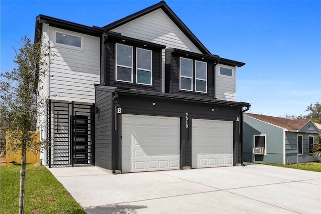 view of front of house featuring concrete driveway, stairway, and an attached garage