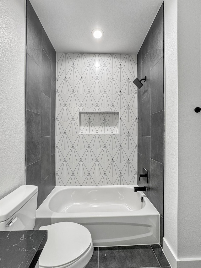 bathroom featuring tub / shower combination, a textured ceiling, toilet, and tile patterned floors