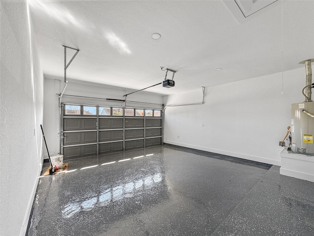 garage with baseboards, gas water heater, and a garage door opener