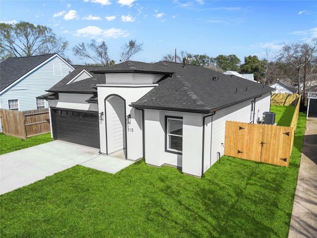 view of front of house with driveway, central air condition unit, a garage, and stucco siding