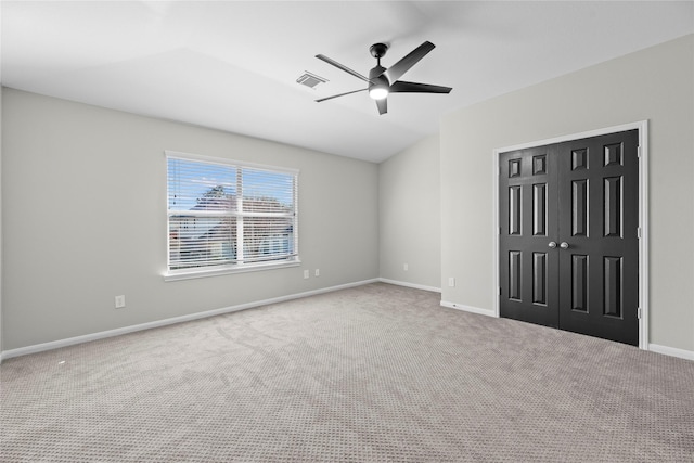 unfurnished bedroom with ceiling fan, carpet floors, visible vents, baseboards, and a closet