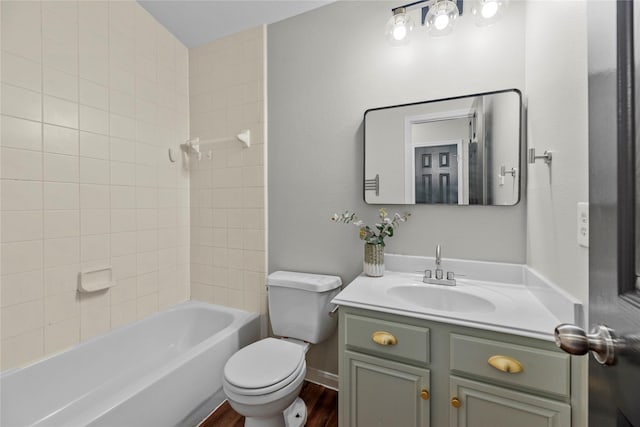 full bathroom featuring bathing tub / shower combination, vanity, toilet, and wood finished floors