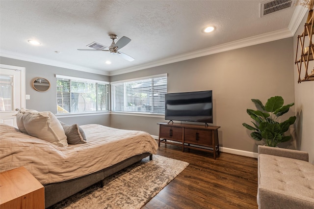 bedroom with ornamental molding, visible vents, and dark wood finished floors