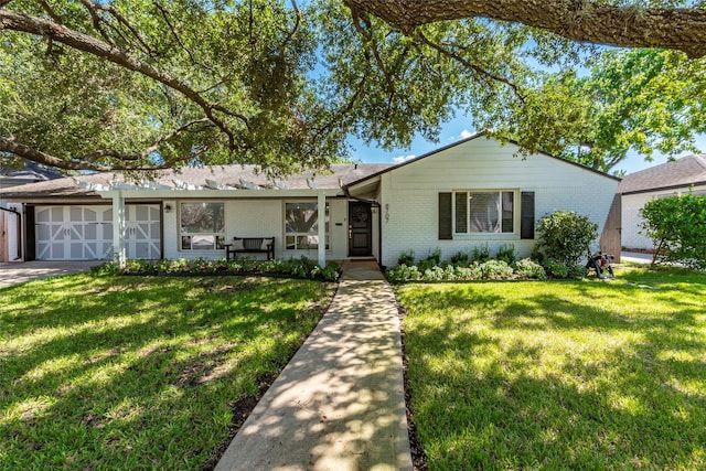 ranch-style house with a front lawn and brick siding