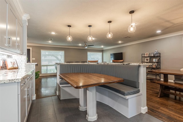 dining area featuring ornamental molding, recessed lighting, dark wood-type flooring, and visible vents