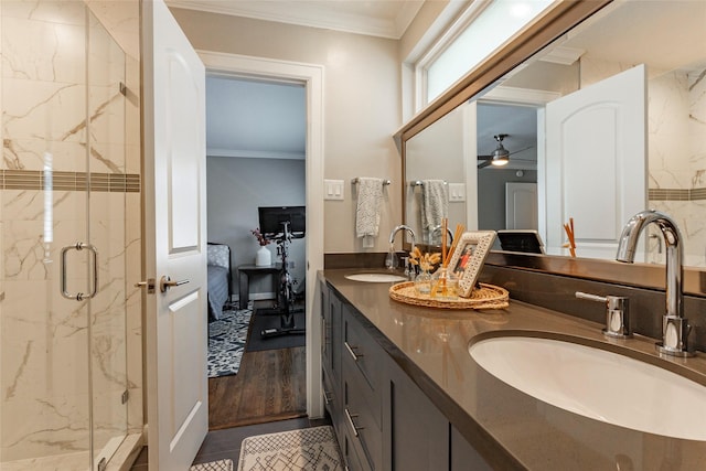 bathroom featuring ornamental molding, a sink, and ensuite bath