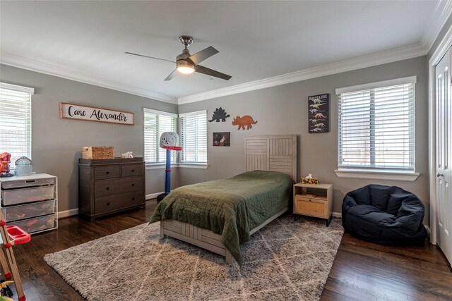 bedroom with ceiling fan, ornamental molding, wood finished floors, and baseboards