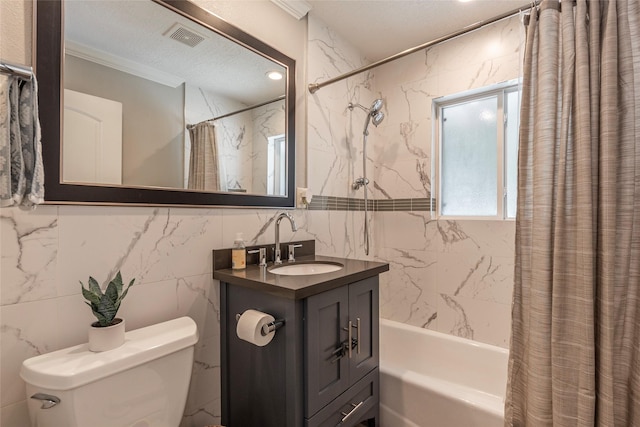 bathroom with a textured ceiling, toilet, visible vents, vanity, and shower / bathtub combination with curtain