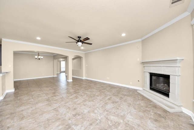 unfurnished living room with ceiling fan with notable chandelier, visible vents, baseboards, and a tile fireplace