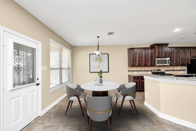 dining room featuring recessed lighting, visible vents, baseboards, and light tile patterned floors