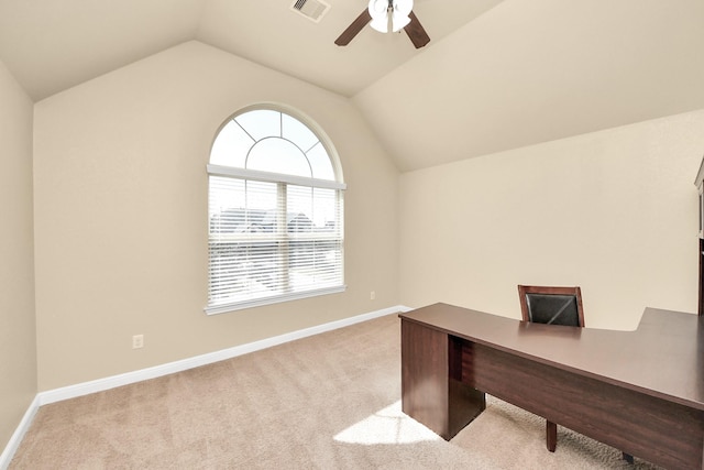 unfurnished office with ceiling fan, lofted ceiling, light carpet, visible vents, and baseboards