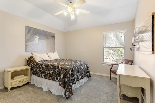 bedroom featuring light colored carpet, a ceiling fan, baseboards, and vaulted ceiling