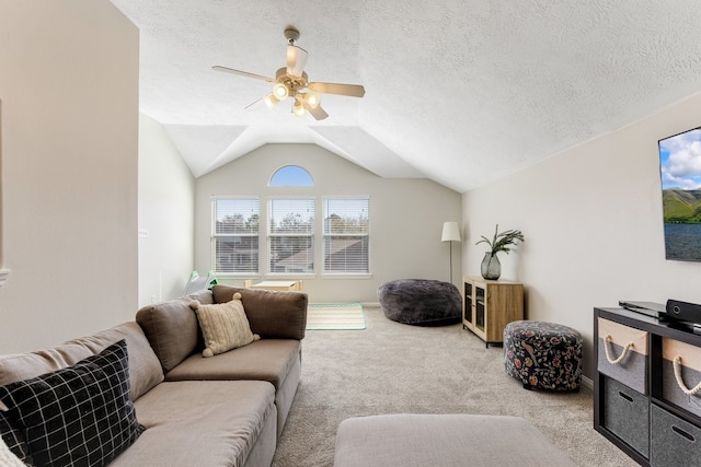 living room featuring light carpet, a textured ceiling, a ceiling fan, and vaulted ceiling