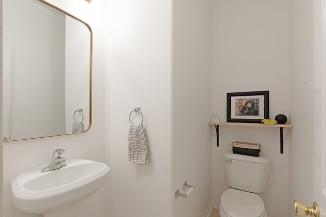 bathroom featuring a sink and toilet