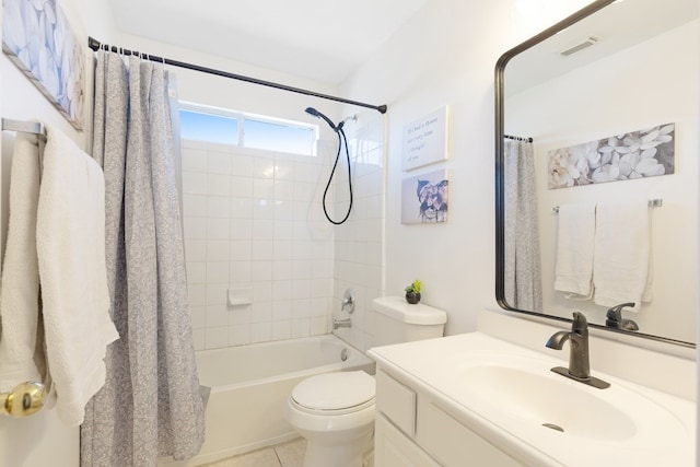 bathroom featuring visible vents, toilet, shower / tub combo with curtain, tile patterned floors, and vanity