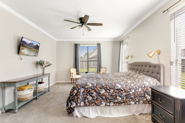 bedroom with baseboards, ceiling fan, carpet flooring, and crown molding