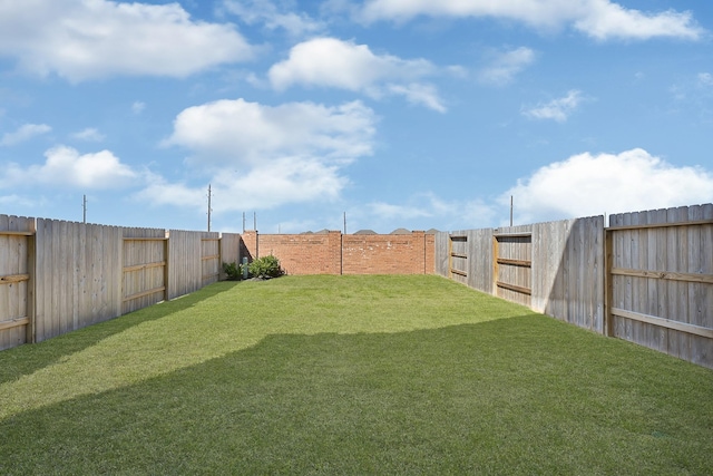 view of yard featuring a fenced backyard