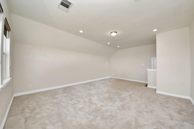 bonus room featuring lofted ceiling, baseboards, visible vents, and recessed lighting