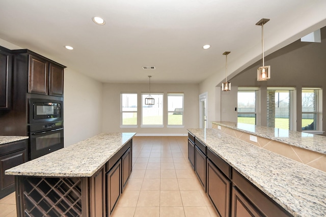 kitchen with light tile patterned floors, recessed lighting, visible vents, black appliances, and decorative light fixtures