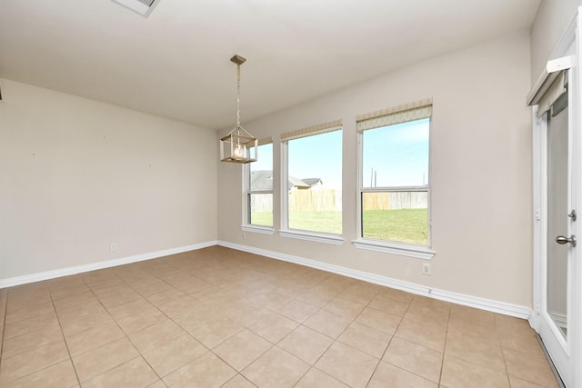 spare room with light tile patterned flooring, visible vents, baseboards, and an inviting chandelier