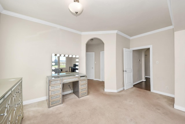 office space featuring arched walkways, light colored carpet, and baseboards