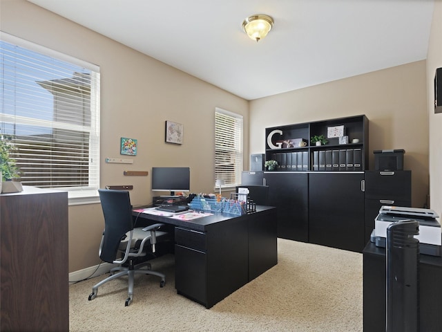 office space with baseboards