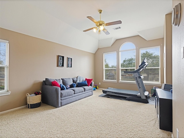 workout area with visible vents, baseboards, ceiling fan, vaulted ceiling, and carpet floors