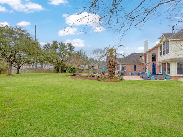 view of yard with a patio and fence