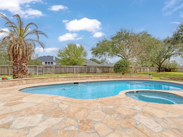 view of swimming pool with a fenced in pool, an in ground hot tub, and a fenced backyard