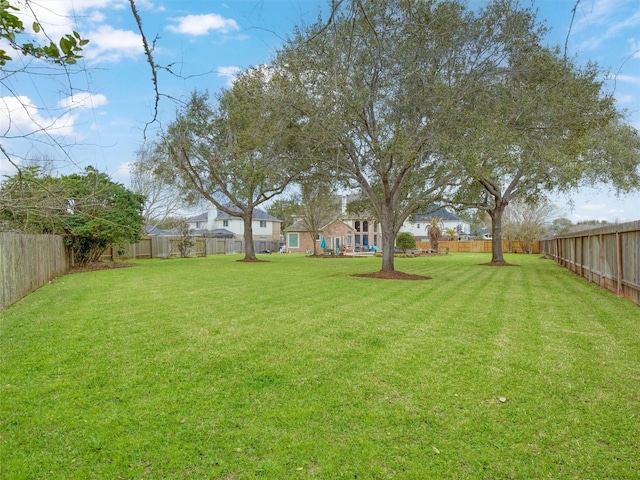 view of yard featuring a fenced backyard