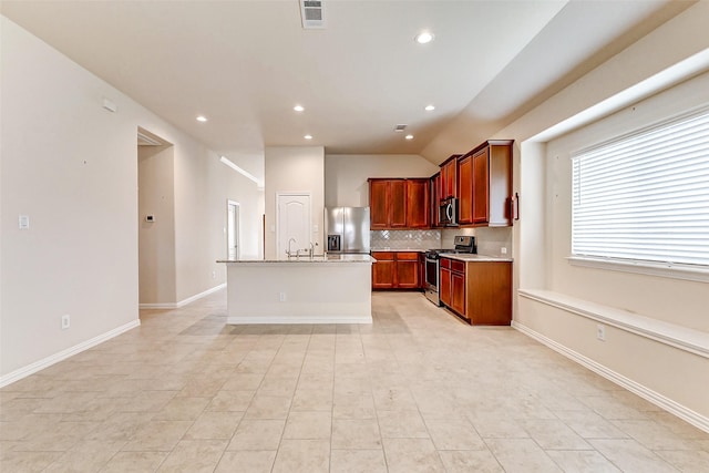 kitchen with stainless steel appliances, visible vents, baseboards, light countertops, and tasteful backsplash