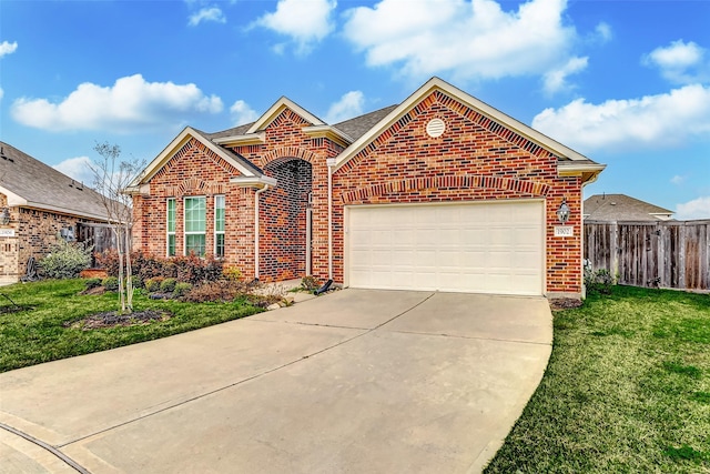 view of front of property with a garage, brick siding, fence, driveway, and a front yard