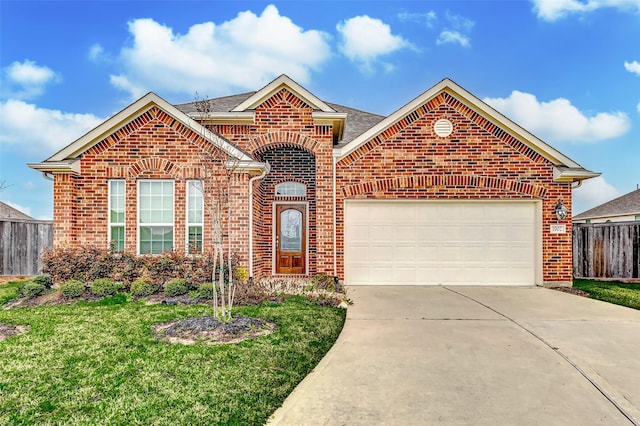 view of front of house with brick siding, fence, a garage, driveway, and a front lawn