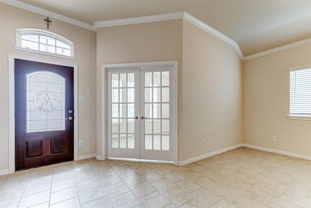 entryway featuring ornamental molding, french doors, and baseboards