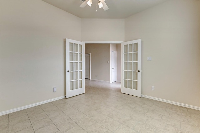 unfurnished room featuring ceiling fan, baseboards, and french doors