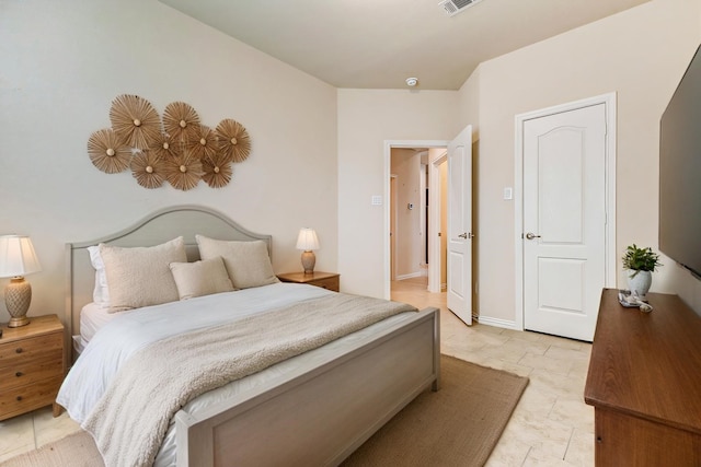 bedroom with visible vents and baseboards