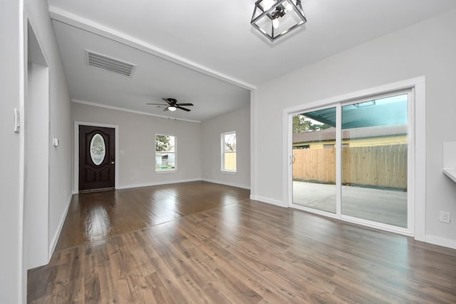 foyer with ceiling fan, wood finished floors, visible vents, and baseboards