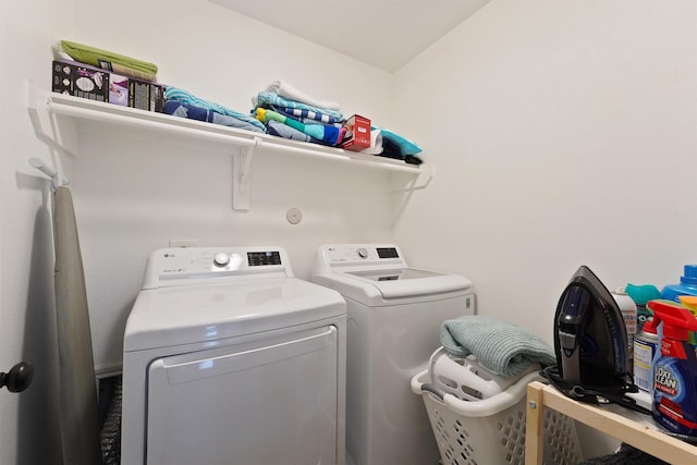 clothes washing area with laundry area and washing machine and clothes dryer