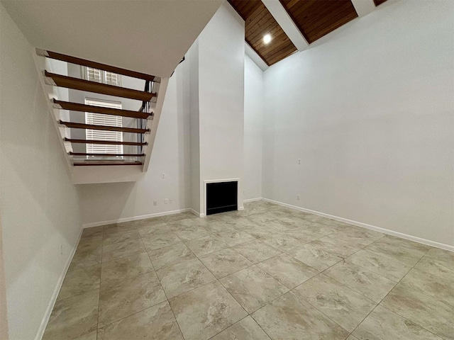 interior space with stairway, recessed lighting, wood ceiling, and baseboards