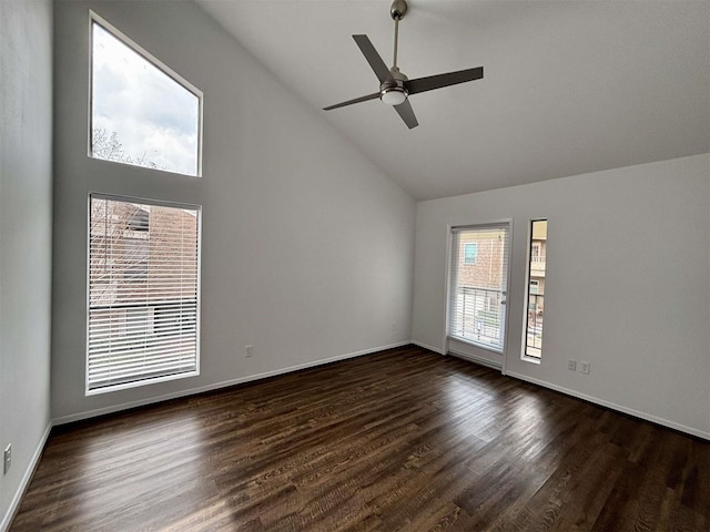 empty room with baseboards, high vaulted ceiling, ceiling fan, and dark wood-type flooring