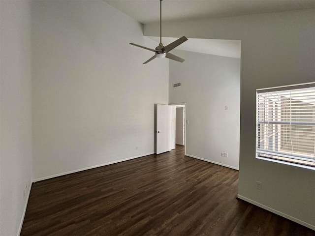 unfurnished room with baseboards, visible vents, ceiling fan, dark wood-style flooring, and high vaulted ceiling