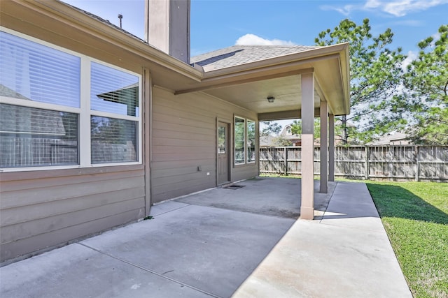 view of patio featuring fence