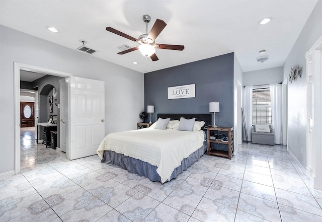 bedroom with arched walkways, ceiling fan, recessed lighting, visible vents, and baseboards