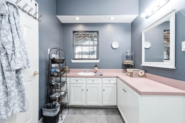 bathroom with recessed lighting and vanity