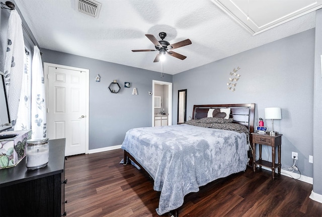 bedroom featuring visible vents, dark wood finished floors, attic access, and baseboards