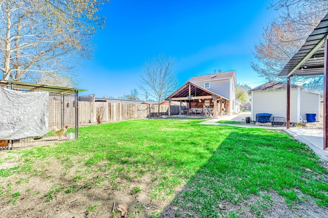 view of yard with a fenced backyard, a patio, and a gazebo