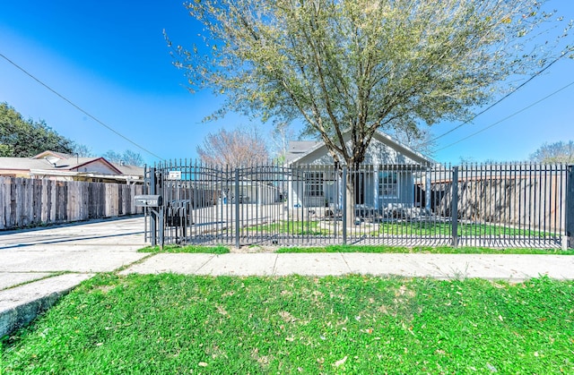 bungalow featuring a gate and fence