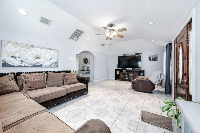 living area with lofted ceiling, visible vents, arched walkways, and recessed lighting