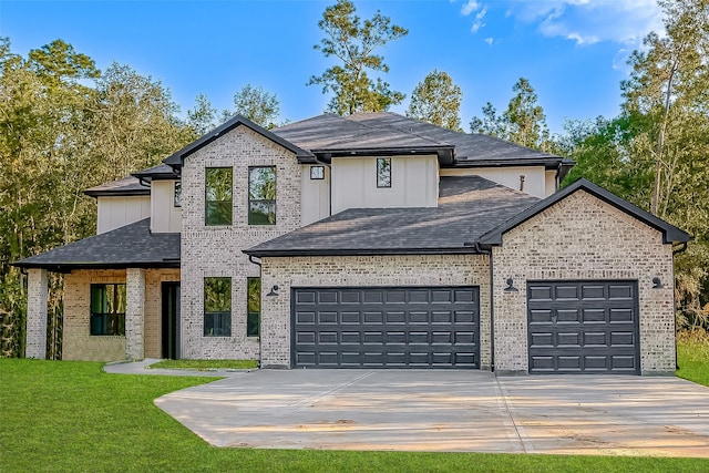 view of front of home featuring a garage, a shingled roof, concrete driveway, a front yard, and brick siding