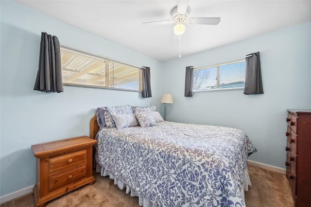 bedroom with carpet floors, baseboards, and a ceiling fan